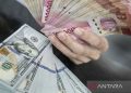 Fluktuasi Rupiah: Turun 25 Poin ke Rp15.950 per Dolar AS