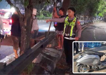 Petugas kepolisian bersama warga mengevakuasi korban kecelakaan tunggal di tikungan Jalan Brawijaya, Dusun Tundan, Tamantirto