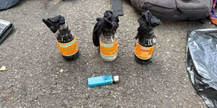 Pria Bawa Botol Bersumbu di Aksi Unjuk Rasa Ditetapkan Sebagai Tersangka