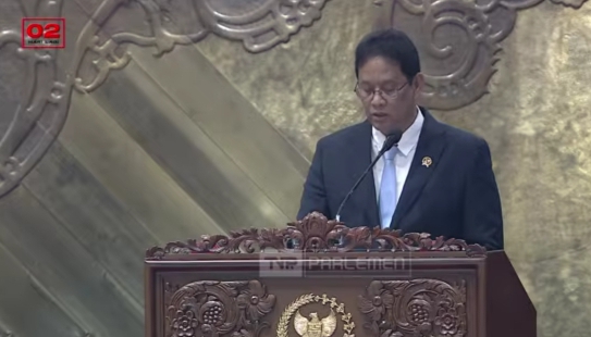 : Menteri Keuangan (Menkeu), Purbaya Yudhi Sadewa saat Pembicaraan Tingkat II/Pengambilan Keputusan terhadap RUU tentang Pertanggungjawaban atas Pelaksanaan APBN Tahun Anggaran 2025 dalam Rapat Paripurna DPR RI Ke-3 Masa Persidangan I Tahun Sidang 2026–2027 di Jakarta, Kamis (27/8/2026). (Tangkapan Layar Kanal YouTube TV Parlemen)