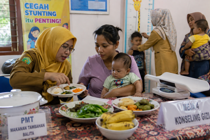 : Ilustrasi kegiatan pemberian makanan tambahan bagi balita di Posyandu. (Istimewa)